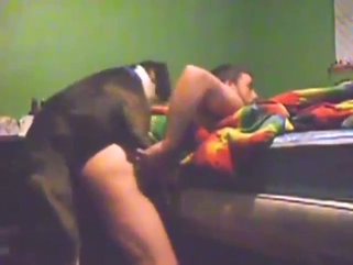 Guy has a round ass, moans with a dog inside